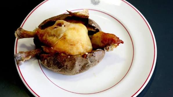 Roasted ortolan bunting served whole on a plate